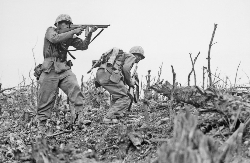  Two Marines from the 2nd Battalion, 1st Marine Regiment during fighting at Wana Ridge during the Battle of Okinawa, May 1945 (credit: PUBLIC DOMAIN)