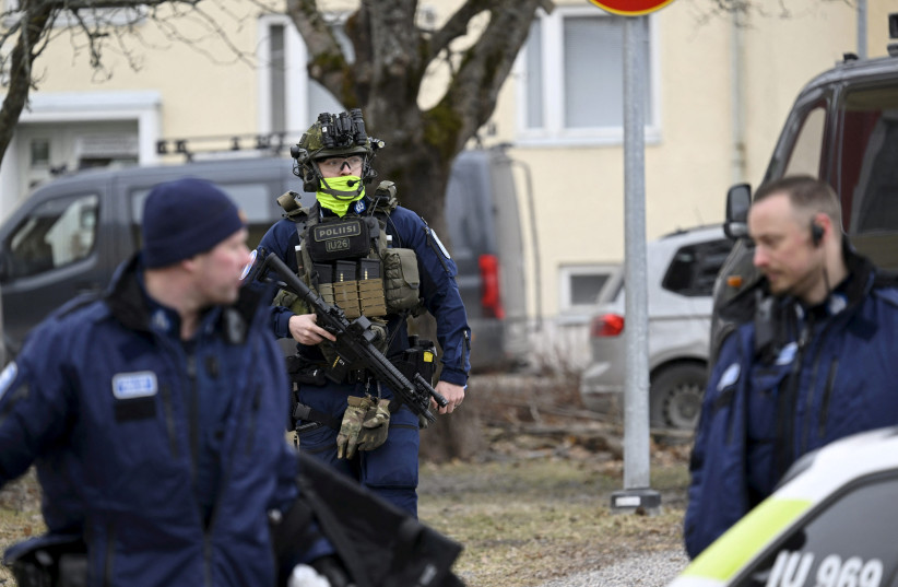  Police officers operate at the Viertola comprehensive school in Vantaa, Finland, on April 2, 2024. Three minors were injured in a shooting at the school on Tuesday morning. A suspect, also a minor, has been apprehended. (credit: Lehtikuva/Markku Ulander via REUTERS.)
