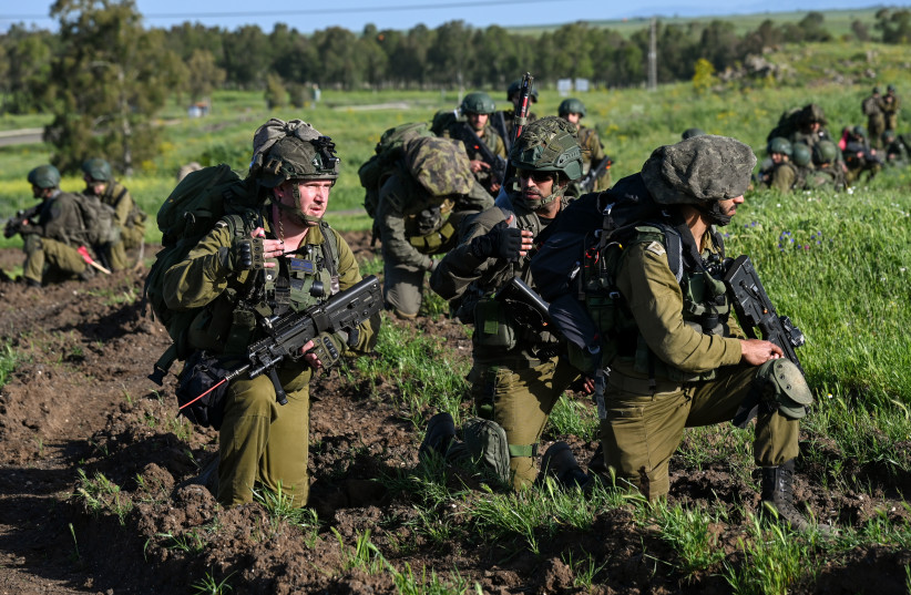  IDF Reserve infantrymen take part in a military maneuver of their battalion in Golan Heights, on April 1, 2024 (credit: MICHAEL GILADI/FLASH90)