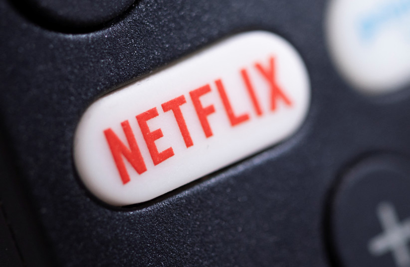  The Netflix logo is seen on a TV remote controller, in this illustration taken January 20, 2022. (credit: DADO RUVIC/REUTERS)