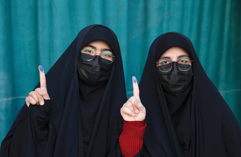 Iranian women pose for a photo after voting in parliamentary elections at a Tehran polling station on March 1.