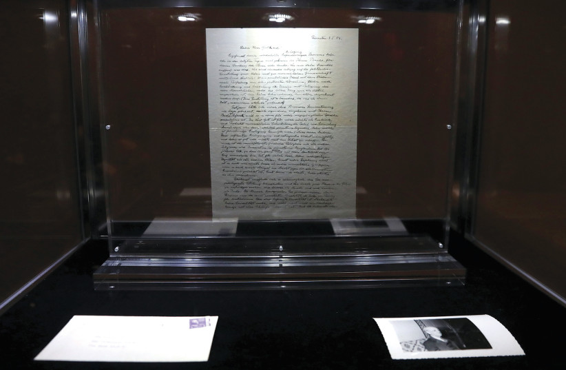  A letter known as ‘The God Letter’ written by Albert Einstein and addressed to philosopher Eric Gutkind in 1954 is seen on display at Christie’s auction house ahead of its sale in New York City.  (credit: SHANNON STAPLETON/ REUTERS)