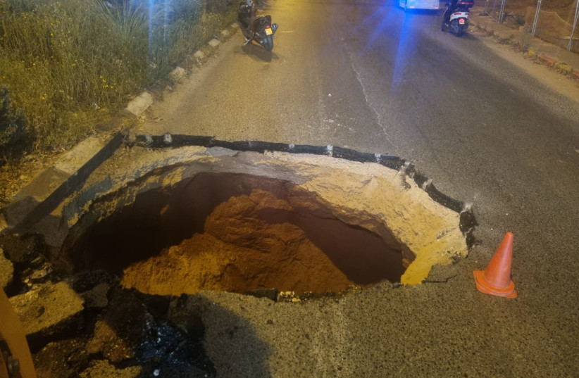  A sinkhole that was opened up on Road 4622 in central Israel, April 3, 2024 (credit: ISRAEL POLICE)