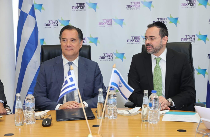  Greek Health Minister Adonis Georgiadis and his Israeli counterpart MK Uriel Busso sign an agreement. April 8, 2024. (credit: MIRI SHIMONOVICH/GPO)
