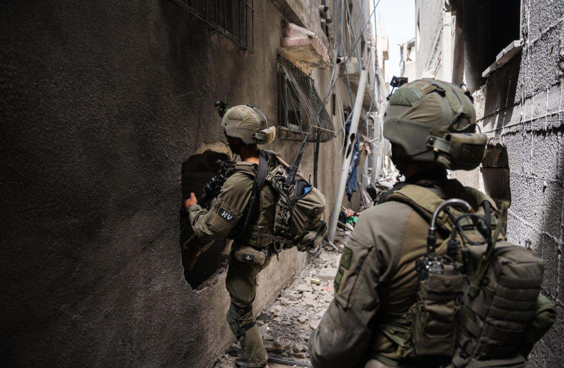 IDF soldiers from the Nahal Brigade operate in the central Gaza Strip, April 10, 2024 (credit: IDF SPOKESPERSON'S UNIT)