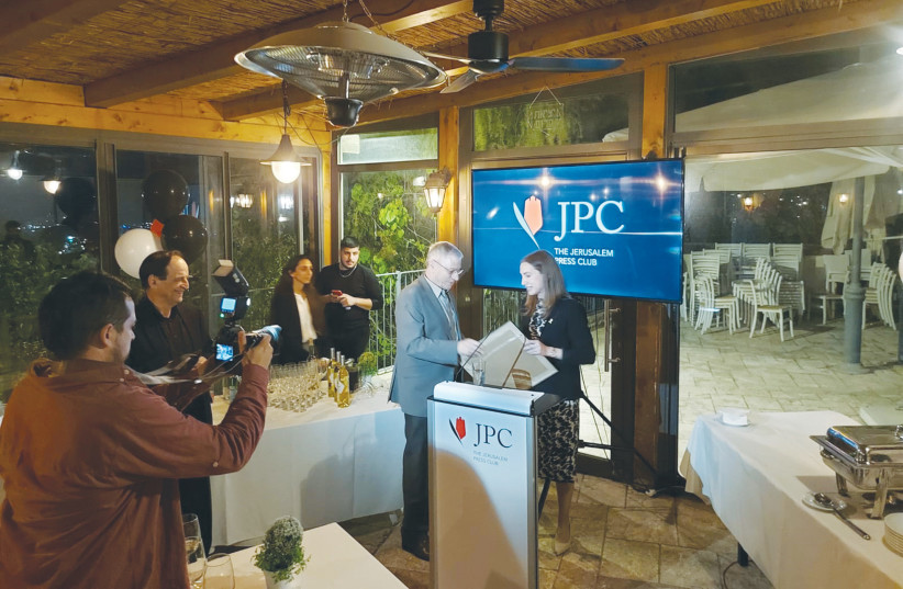  URI DROMI receives a memento of his years at the helm of JPC from his successor, Talia Dekel-Fleissig.  (credit: STEVE LINDE)