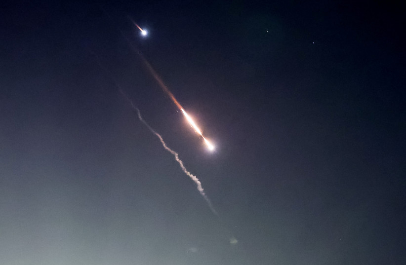  Objects are seen in the sky above Jerusalem after Iran launched drones and missiles towards Israel, in Jerusalem April 14, 2024. (credit: RONEN ZVULUN/REUTERS)