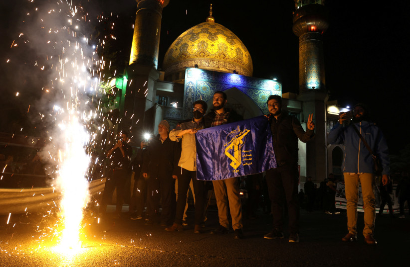  Iranians celebrate on a street, after the IRGC attack on Israel, in Tehran, Iran, April 14, 2024. (credit: VIA REUTERS)