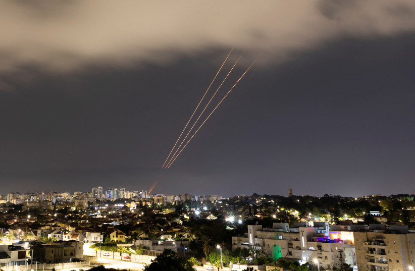  An anti-missile system operates after Iran launched drones and missiles towards Israel, as seen from Ashkelon, Israel April 14, 2024. (credit: REUTERS)