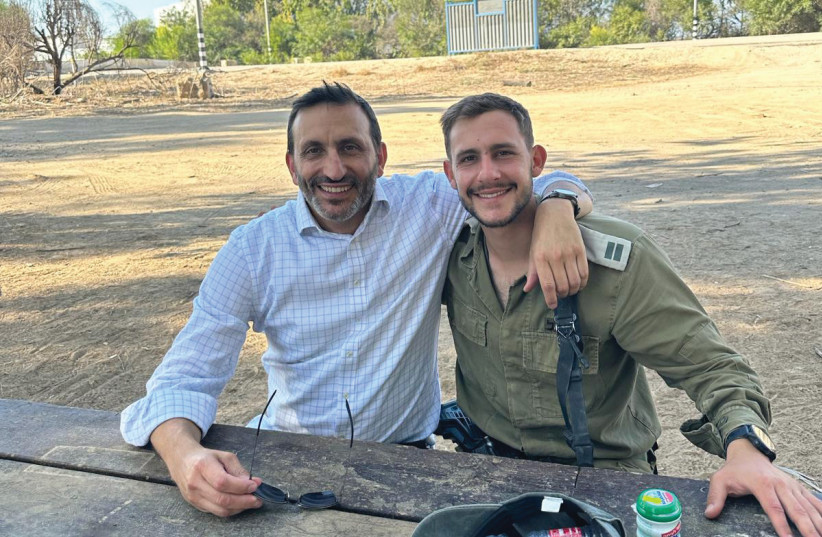  RABBI DORON PEREZ WITH Daniel outside Nahal Oz Base, on the Shabbat before Rosh Hashanah. (credit: Perez family)
