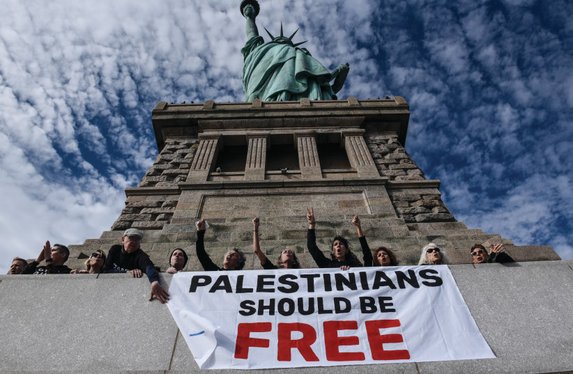  JEWISH VOICE for Peace ‘activists’ occupy of the Statue of Liberty pedestal, in New York City,  Nov. 6, 2023. (credit: STEPHANIE KEITH/ GETTY IMAGES)