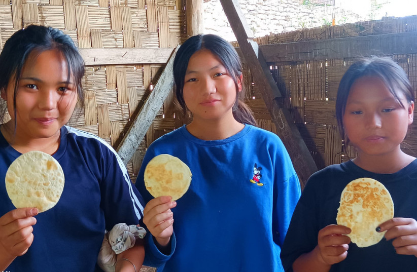  Community members actively engaging in matzah baking at the Shavei Israel community center located in Churachandpur, Manipur, and Aizawl, Mizoram. (18/4/2024) (credit: SHAVEI ISRAEL)