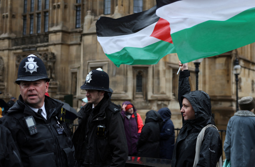  Police officers keep watch as campaigners queue to lobby MPs in Parliament ahead of a debate to hold a vote for a ceasefire in Gaza, amid the ongoing conflict between Israel and the Palestinian Islamist group Hamas, in London, Britain, February 21, 2024. (credit: REUTERS/Isabel Infantes)