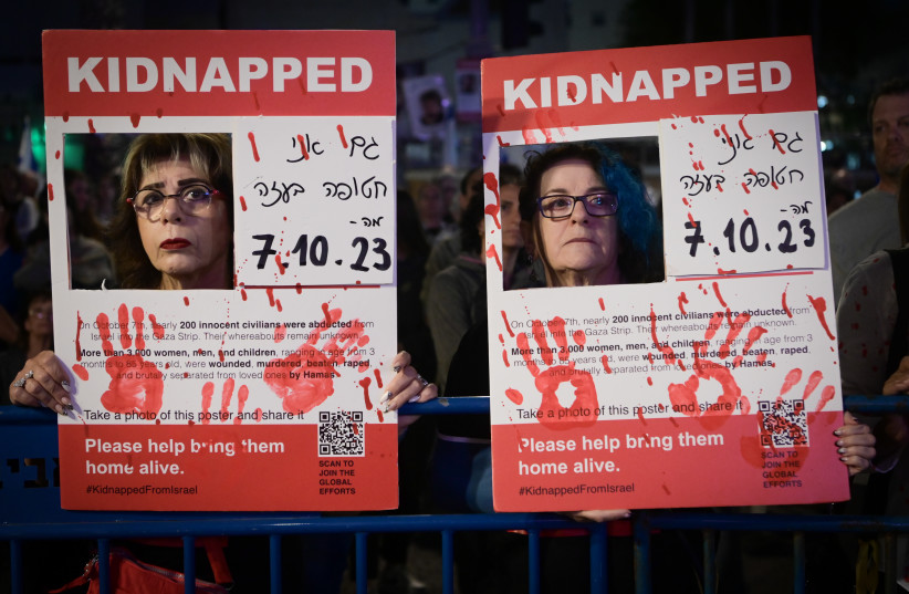  Israelis attend a rally calling for the release of Israelis held kidnapped by Hamas terrorists in Gaza at ''Hostage Square'' in Tel Aviv, April 20, 2024.  (credit: AVSHALOM SASSONI/FLASH90)