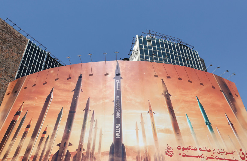  AN ANTI-ISRAEL billboard with a picture of Iranian missiles is seen on a street in Tehran last week. When Iran fired over 300 projectiles at us, it seemed like the region could be heading toward World War III, says the writer. (credit: Majid Asgaripour/WANA via Reuters)