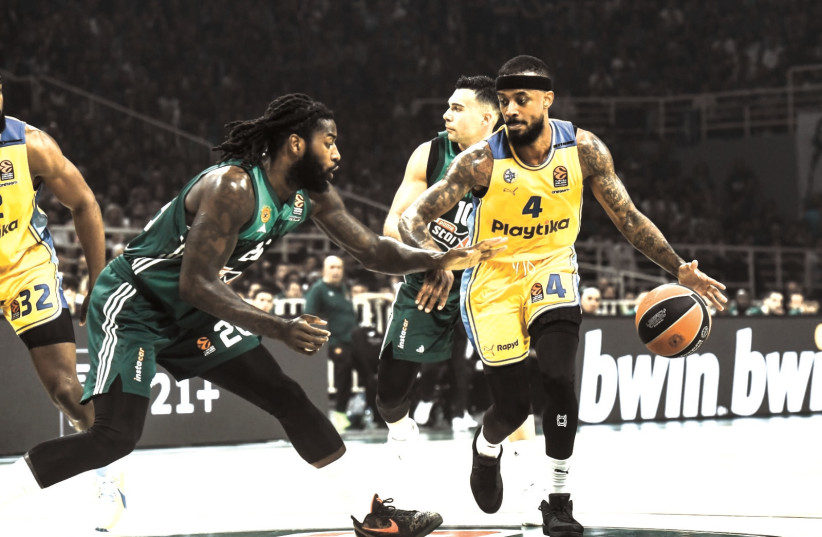  MACCABI TEL AVIV’S Lorenzo Brown (right) dribbles against Panathinaikos defender Mathias Lessort during the yellow-and-blue’s 91-87 victory. (24/4/2024) (credit: TOURRETTE PHOTOGRAPHY/ANDREAS PAPAKONSTANTINOU)