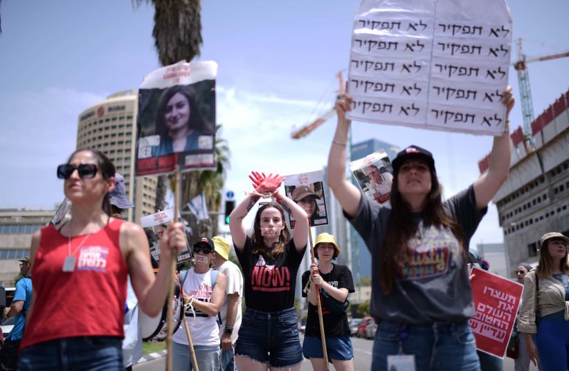  Relatives of Israelis held hostage in the Gaza Strip and supporters protest calling for their release outside Hakirya Base in Tel Aviv, April 25, 2024. (credit: TOMER NEUBERG/FLASH90)