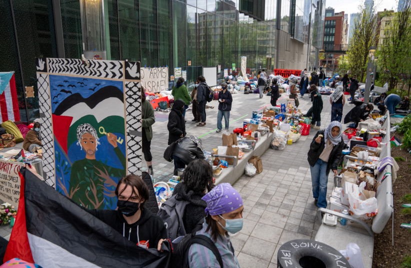  Students and pro-Palestinian supporters occupy a plaza at the New York University (NYU) campus, during the ongoing conflict between Israel and the Palestinian Islamist group Hamas, in New York City, U.S., April 27, 2024 (credit: REUTERS/David Dee Delgado)