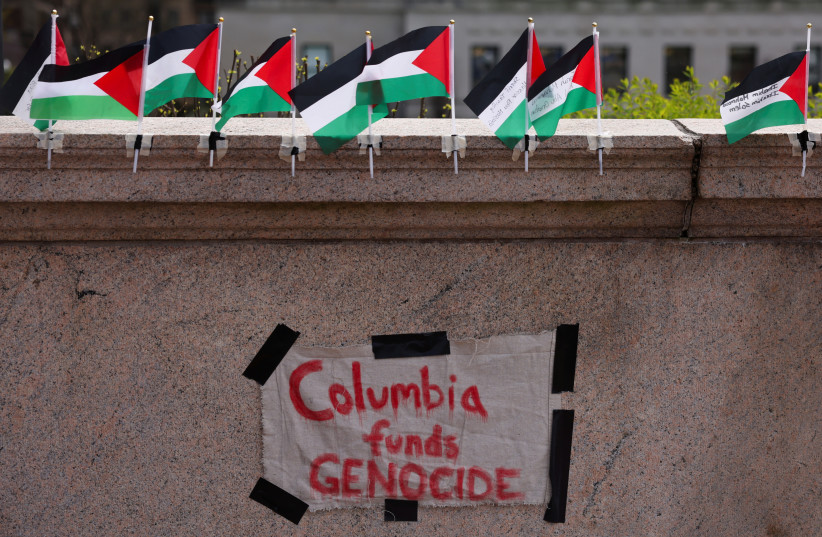  A sign is seen at Columbia University near a protest encampment on the main campus in support of Palestinians, during the ongoing conflict between Israel and the Palestinian Islamist group Hamas, in New York City, U.S., April 27, 2024. (credit:  REUTERS/Caitlin Ochs)