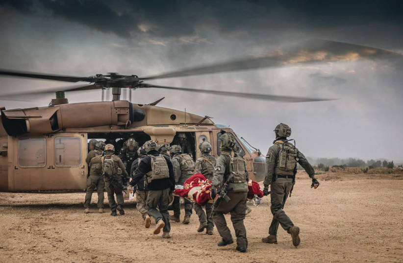  IDF TROOPS carry out medical evacuations. (credit: IDF SPOKESPERSON'S UNIT)