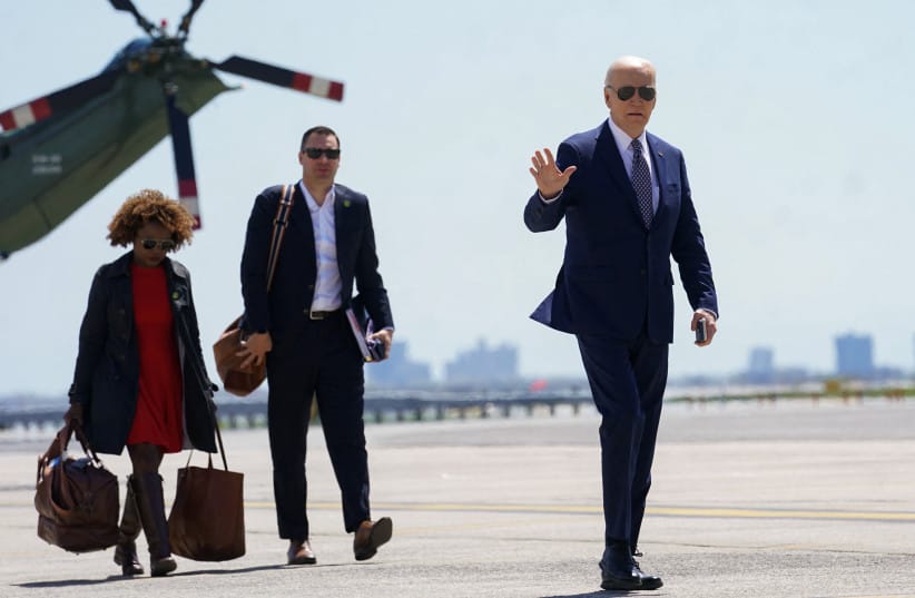 US President Joe Biden waves as he walks to board Air Force One to return to Washington from JFK Airport in New York City, US, April 26, 2024.