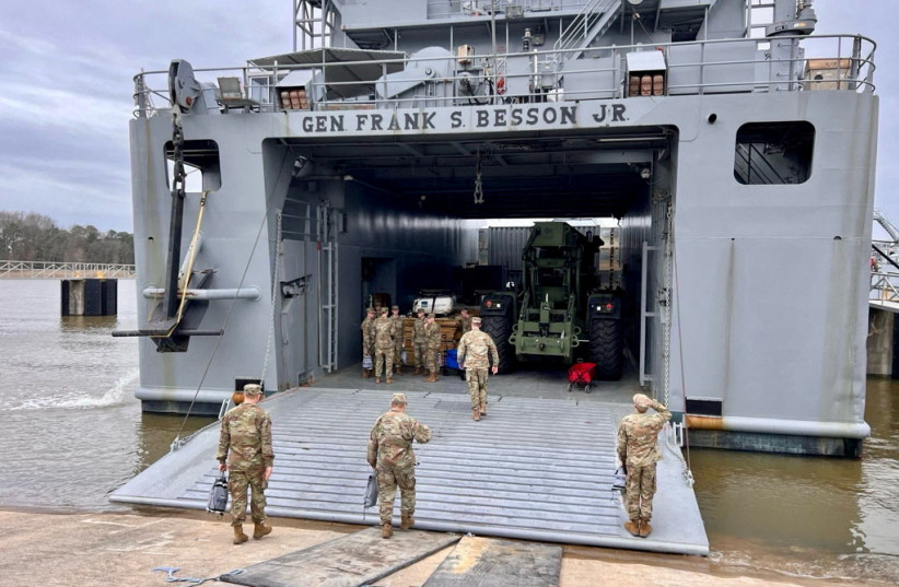  Personnel board the USAV General Frank S. Besson as it departs to the Eastern Mediterranean after President Biden said the US would provide humanitarian aid to Gaza by sea, at Joint Base Langley-Eustis, US, March 9, 2024.  (credit: US CENTCOM via X/Handout via REUTERS)