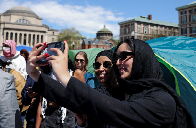  U.S. Democratic House Representative Ilhan Omar (D-MN) visits the student protest encampment as protests continue at Columbia University, during the ongoing conflict between Israel and the Palestinian Islamist group Hamas, in New York City, U.S., April 25, 2024. (credit: REUTERS/CAITLIN OCHS)