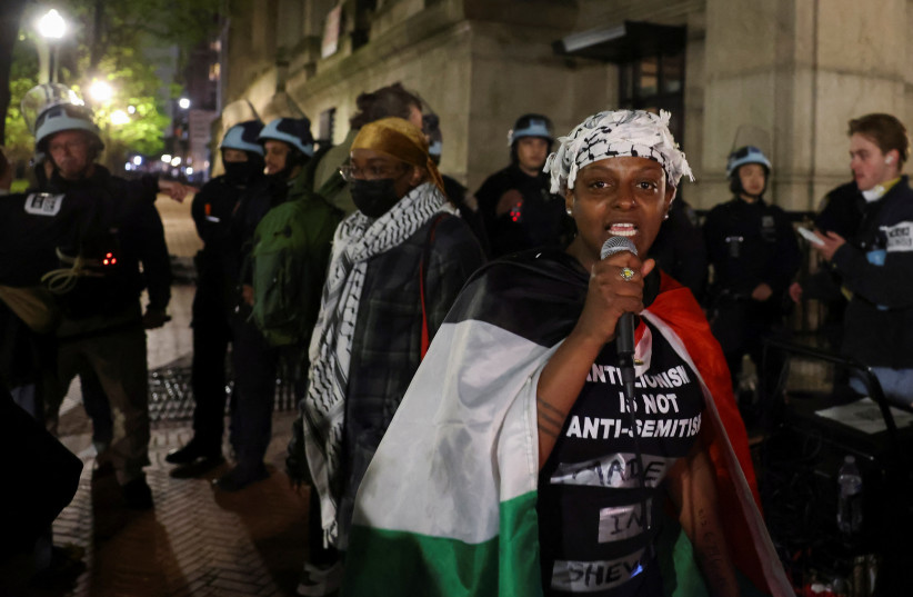  People protest as the police stand guard at Columbia University, where a building occupation and protest encampment had been set up in support of Palestine (credit: REUTERS/CAITLIN OCHS)