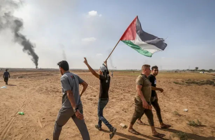  Palestinians after crossing the border fence with Israel in the Gaza Strip, October 7, 2023  (credit: ABED RAHIM KHATIB/FLASH90)