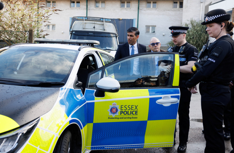  British Prime Minister Rishi Sunak is shown a new Electric Hybrid deployment police car during a media visit, in Harlow, Britain, February 16, 2024 (credit: DAN KITWOOD/POOL VIA REUTERS)
