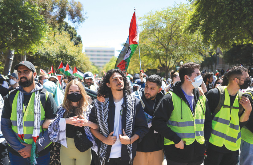  PROTESTERS ATTEND a demonstration in support of Palestinians in Gaza, at UCLA in Los Angeles, this week. Members of nearby Jewish communities now take detours to avoid confrontational student protests, the writer notes. Uploaded on 1/5/2024 (credit: REUTERS/DAVID SWANSON)
