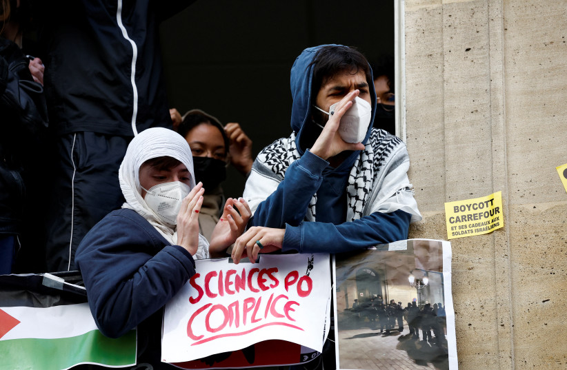  Masked youths take part in the occupation of a building of the Sciences Po University, Paris, France, April 26, 2024. (credit: REUTERS/BENOIT TESSIER)