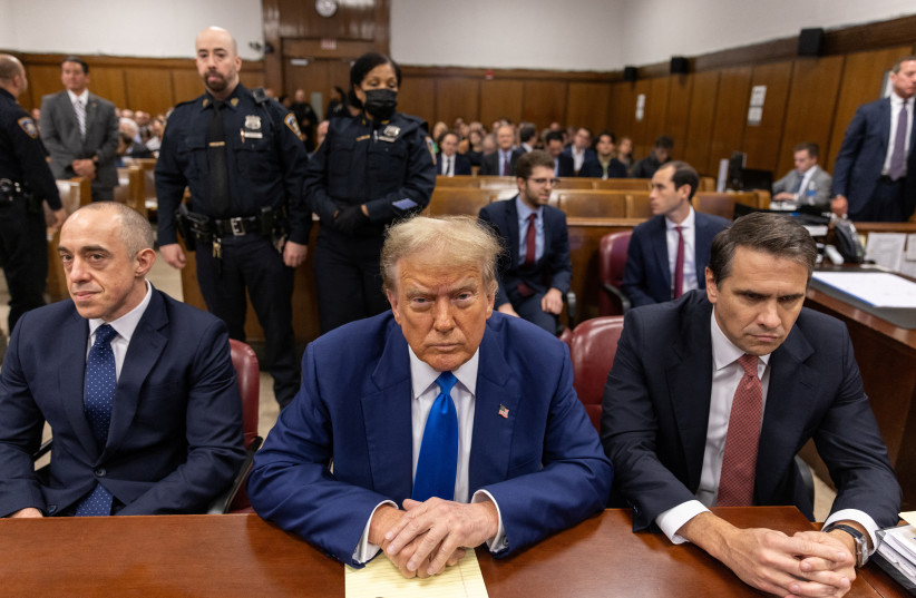 Former US President Donald Trump sits in the courtroom at Manhattan criminal court in New York, US, on Friday, May 3, 2024. Trump faces 34 felony counts of falsifying business records as part of an alleged scheme to silence claims of extramarital sexual encounters during his 2016 presidential campai (credit: JEENAH MOON/POOL VIA REUTERS)