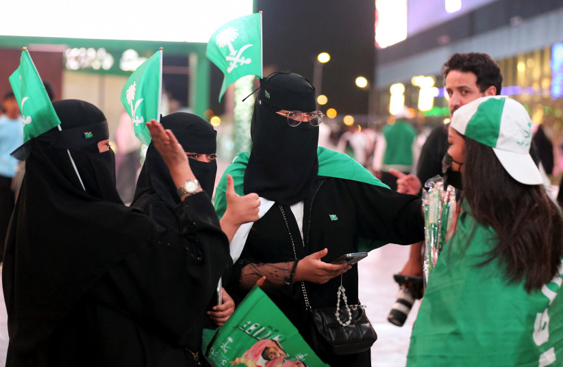 Saudi women participate in the celebrations of the Flag Day at The Boulevard in Riyadh, Saudi Arabia, March 11, 2023. (credit: Ahmed Yosri/Reuters)