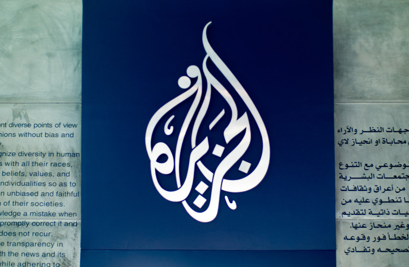 An Al Jazeera logo is seen over the journalistic code of ethics in Arabic and English in an illustration.An Al Jazeera logo is seen over the journalistic code of ethics in Arabic and English in an illustration. (credit: FLICKR)