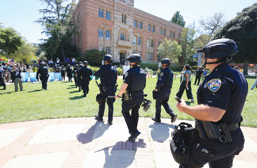  POLICE ARE called in at UCLA in Los Angeles, last week. The rhetoric in these demonstrations frequently flows over into pure antisemitism, while Jewish students and academic staff are often harassed and intimidated, the writer notes.  (credit: DAVID SWANSON/REUTERS)