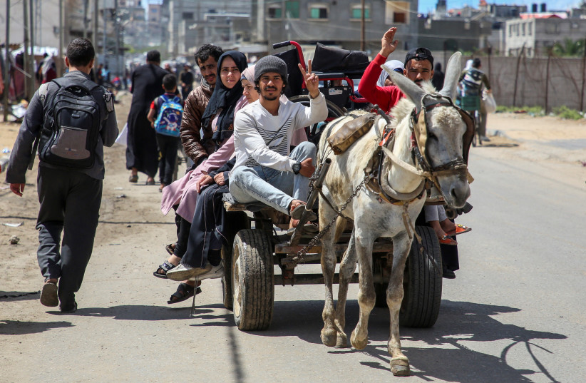  People flee the eastern parts of Rafah after the Israeli military began evacuating Palestinian civilians, May 6, 2024 (credit: REUTERS/Hatem Khaled)