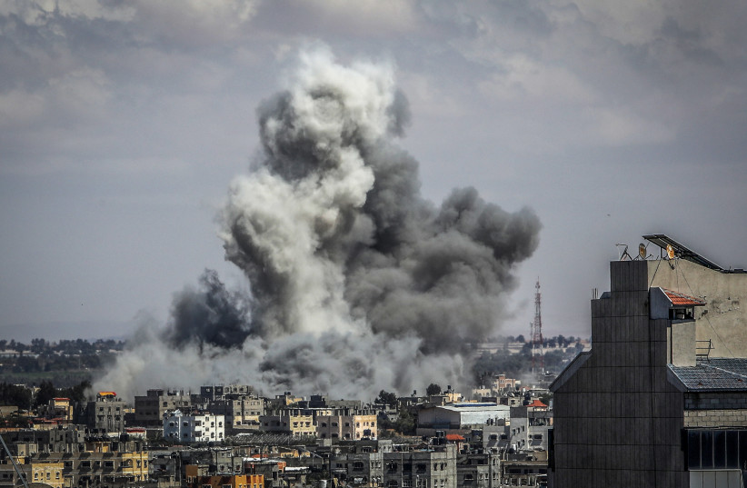  Smoke rises after Israeli airstrikes in Khan Yunis as it seen from Rafah, in the southern Gaza Strip, May 6, 2024 (credit: ABED RAHIM KHATIB/FLASH90)