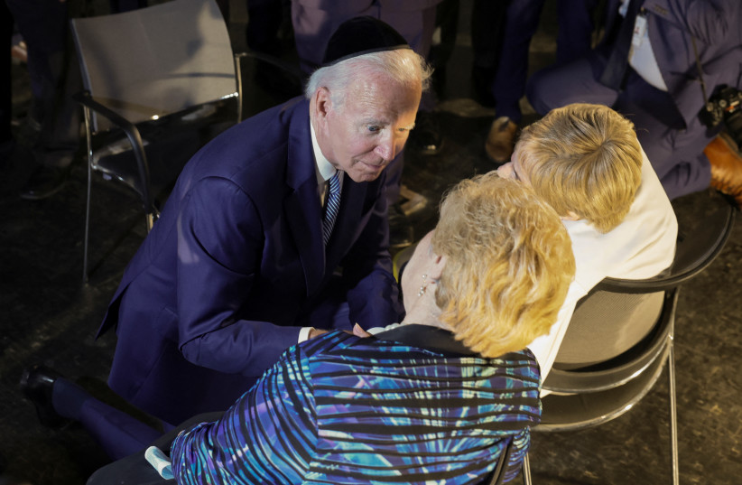  US President Joe Biden meets with holocaust survivors Dr. Gita Cycowicz and Rena Quint during his visit to the Yad Vashem Holocaust Remembrance Center in Jerusalem, July 13, 2022. (credit: REUTERS/EVELYN HOCKSTEIN)