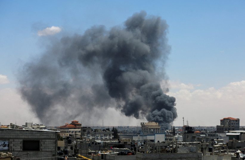  Smoke rises after an Israeli strike as Israeli forces launch a ground and air operation in the eastern part of Rafah, in the southern Gaza Strip May 7, 2024. (credit: REUTERS/Hatem Khaled)