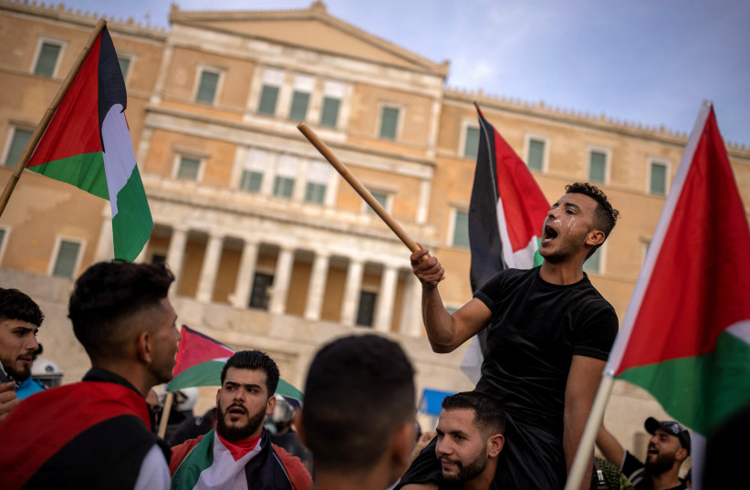 Palestinians and pro-Palestinian demonstrators protest in front of the Greek parliament, amid the ongoing conflict between Israel and the Palestinian Islamist group Hamas, in Athens, Greece, May 7, 2024. (credit: ALKIS KONSTANTINIDIS / REUTERS)