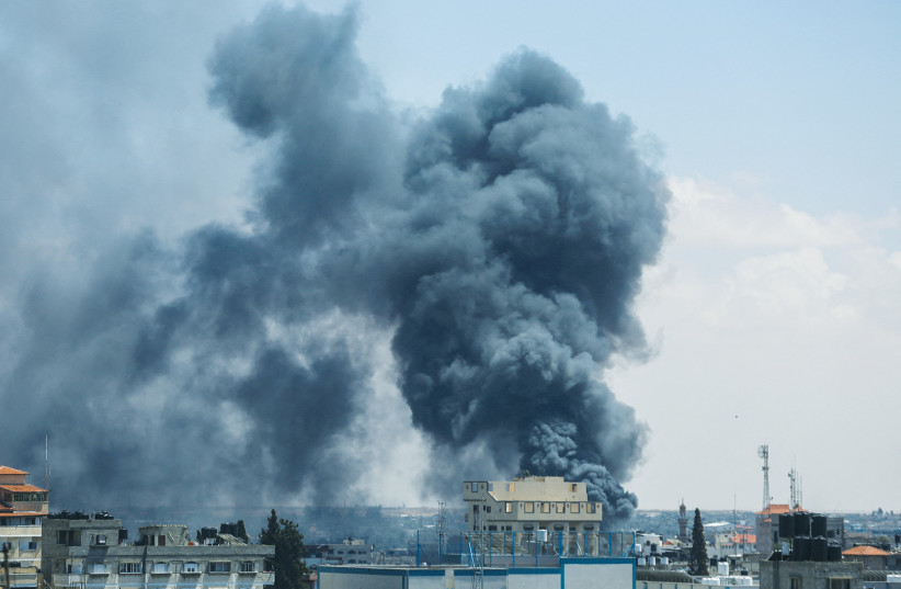  SMOKE RISES after an Israeli strike in Rafah, in the southern Gaza Strip, this week. (credit: Hatem Khaled/Reuters)