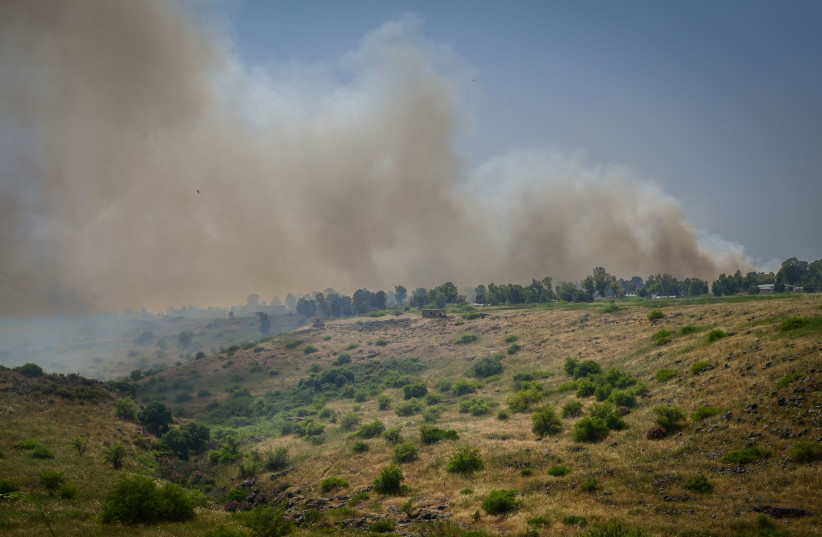  Israeli firefighter teams with the help of airplanes and Israeli soldiers try to extinguish huge wildfires following a massive missile attack in the northern Israeli town of Katsrin, Golan Heights on May 17, 2024. (credit: MICHAEL GILADI/FLASH90)