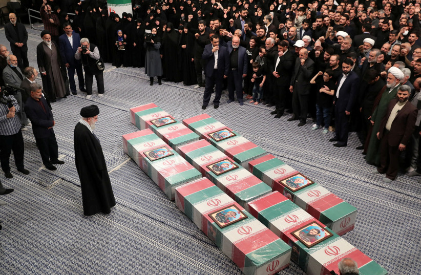  Iran's Supreme Leader, Ayatollah Ali Khamenei looks at the coffins of members of the Islamic Revolutionary Guard Corps who were killed in the Israeli airstrike on the Iranian embassy complex in the Syrian capital Damascus, during a funeral ceremony in Tehran, Iran April 4, 2024.  (credit:  Office of the Iranian Supreme Leader/WANA (West Asia News Agency)/Handout via REUTERS)