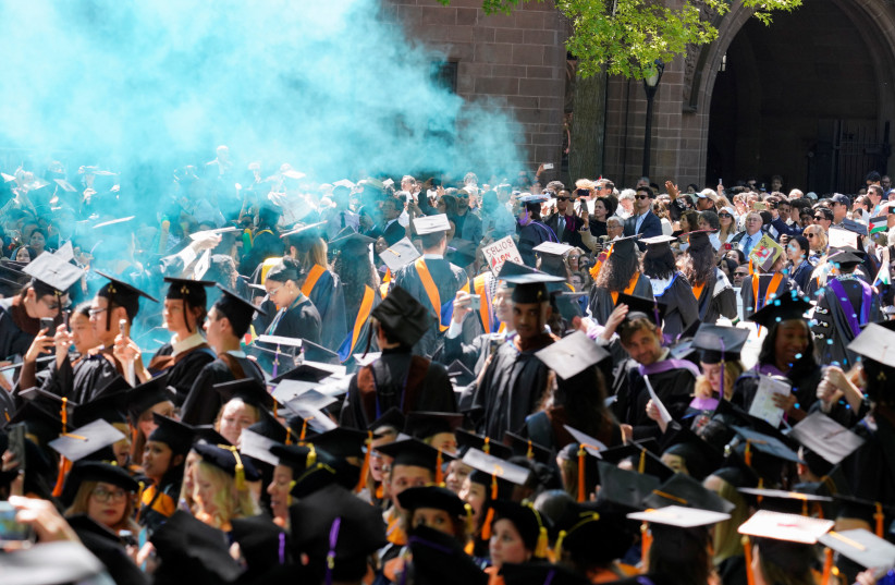 Graduates protest the conflict between Israel and the Palestinian Islamist group Hamas, during the commencement at Yale University, New Haven, Connecticut, U.S., May 20, 2024. (credit: REUTERS/MICHELLE MCLOUGHLIN)