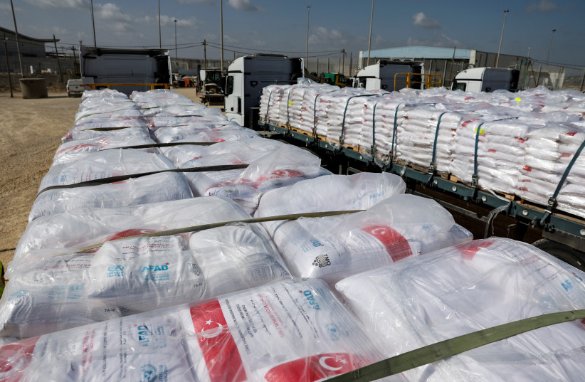  Trucks carrying humanitarian aid for the Gaza Strip are parked, amid the ongoing conflict in Gaza between Israel and the Palestinian Islamist group Hamas, at Erez Crossing in southern Israel, May 5, 2024.  (credit: AMIR COHEN/REUTERS)