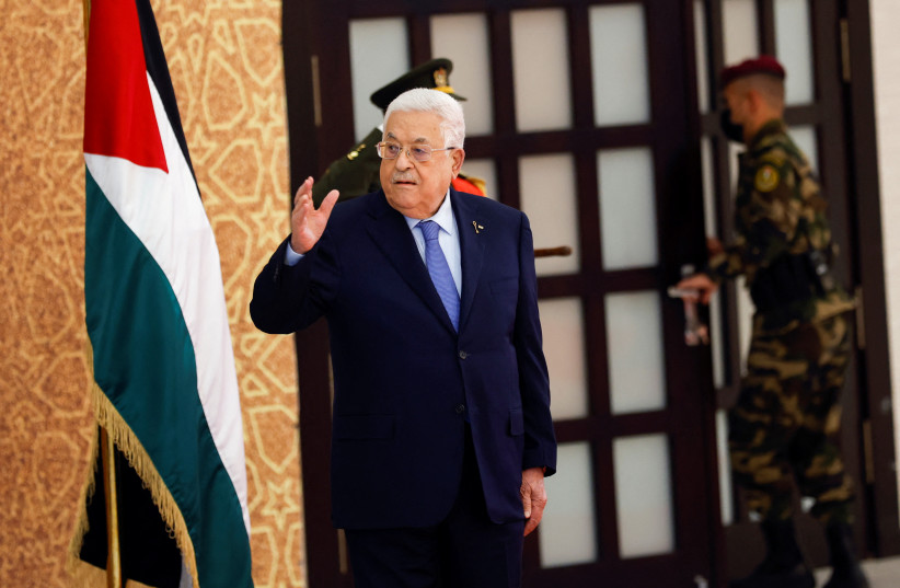  Palestinian President Mahmoud Abbas gestures, as he attends a swearing-in ceremony for the newly formed cabinet, in Ramallah, in the West Bank, March 31, 2024. (credit: REUTERS/Mohammed Torokman)