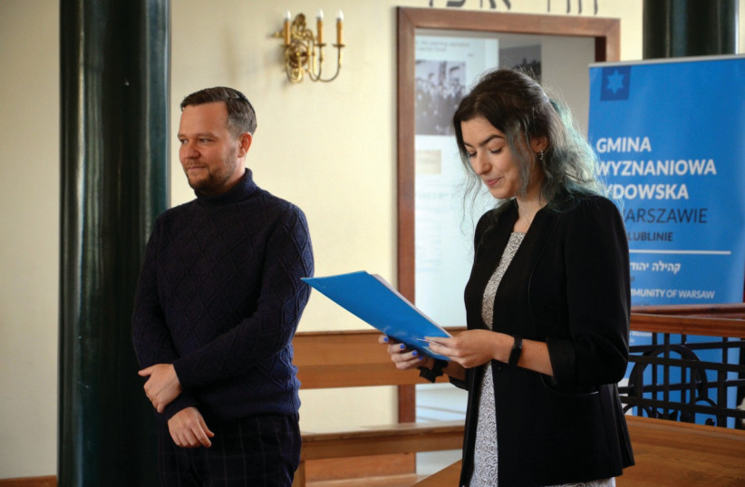  PIOTR NAZARUK (L), whose research has led to the digitization of hundreds of previously thought lost yeshiva library books. Seen here with volunteer Agnieszka Litman. (credit: Courtesy Grodzka Gate – NN Theater Center)