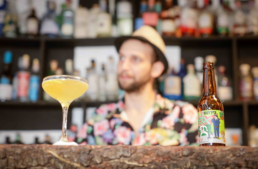  SALTY DOG, a salty-and-sour cocktail made with Opokhmel, a pickle beer from Birateinu, the Jerusalem Beer Center. (credit: MARC ISRAEL SELLEM)