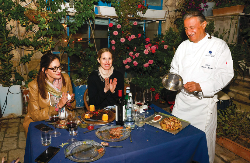 ‘IN JERUSALEM’ Editor Erica Schachne (R) and writer Noa Amouyal break bread (but don’t fill up on it!) with chef Moshe Basson at Eucalyptus. (credit: MARC ISRAEL SELLEM)